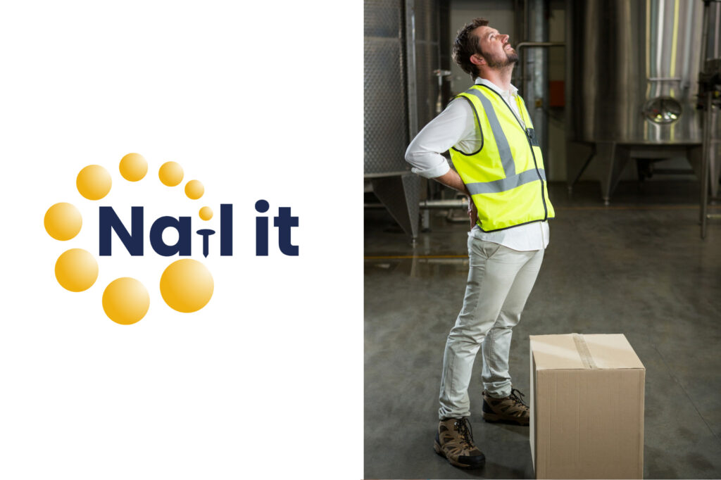 worker with bad back after lifting a box